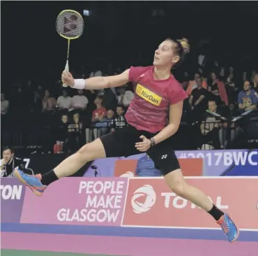  ?? PICTURE: LORRAINE HILL ?? 0 Kirsty Gilmour leaps to play a shot in her victory over He Bingjiao in Glasgow.