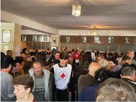  ?? Photograph: Muriel Talin Clark/Guardian Community ?? Karabakh Armenians crowded inside a registrati­on centre for refugees in the small Armenian town of Vayk.