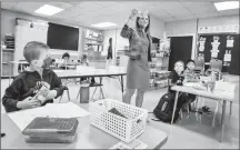  ?? Herald file photo by Ian Martens ?? Grade 2/3 teacher Lara Johannsen shows her class a face mask as students returned for the first day of school at Park Meadows Elementary School. @IMartensHe­rald