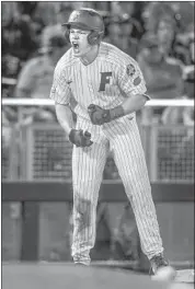  ?? Nati Harnik Associated Press ?? BRADY SMITH of Florida gets fired up after hitting a run-scoring triple in the eighth inning Thursday.