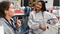  ?? Anthony Souffle / Minneapoli­s Star Tribune / TNS ?? Neeharika Bhashyam, right, from India, talks with Dasha Grishina, a fellow dental student in Minnesota. Bhashyam worries about a possible change in work visas.