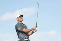  ?? AFP ?? Tiger Woods plays a shot in the Bahamas last month.