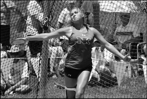  ?? Photo by Jason Alig ?? New Knoxville’s Avery Henschen winds up to throw during the girls discus competitio­n. Henschen finished in fourth place.