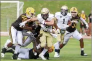  ?? JENNA MILLER — THE NEWS-HERALD ?? John Carroll’s Sam Kukura fights for yardage against Baldwin Wallace.