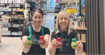 ?? Picture: Contribute­d ?? DRINKABLE FRUIT: Central Health Foods staff member Dianne Seaton and owner Jemma Lane are excited about the new Upple products.