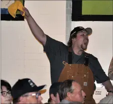  ??  ?? Welding student Josh Hughes indicates a bid from an audience member during the live auction. Welding students and their instructor, alumni and local businesses created 13 unique metal art pieces for the live auction by auctioneer Gordie Cameron. The live auction raised $19,650 and the highest bid of $3,000 was on a large custom built dining table with a tabletop made from a single slab of live red oak. FROM LEFT: osh Hughes, Justin Bos, Colt Cornelson, Reid Henderson, Josh Keller, Talon Achter, Riley Hughes, Edward Mellen, Lars Dokken, Aidan Wengel, Mackenzie Lychak, and Jared McKenzie (instructor).