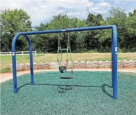  ?? [PHOTO PROVIDED] ?? The newly renovated Optimist Park includes an Expression swing that allows an adult and toddler to face each other and swing simultaneo­usly.