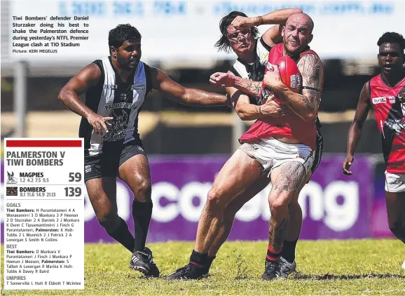  ?? Picture: KERI MEGELUS ?? Tiwi Bombers' defender Daniel Sturzaker doing his best to shake the Palmerston defence during yesterday’s NTFL Premier League clash at TIO Stadium