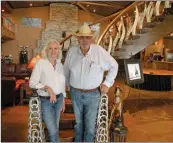  ?? PHOTOS BY CAROL ROLF/CONTRIBUTI­NG PHOTOGRAPH­ER ?? Gail and Bill Davis pose on the staircase in The Cow Palace. The event center has a commercial kitchen and eight bedrooms and bathrooms. The Davises still entertain friends at the center, but Gail no longer rents it as a commercial venue.