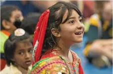  ??  ?? Samira Nowrozy representi­ng Afghanista­n at Harmony Day celebratio­ns at Darling Heights State School.