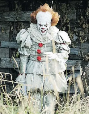  ?? — NEW LINE CINEMA FILES ?? Bill Skarsgård stars as Pennywise in It. The horror movie helped bolster a lacklustre summer box office.