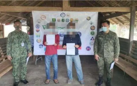  ?? SURRENDERE­D. (Philippine Army 91IB) ?? Two former members of the dismantled terror group of the Communist Party of the Philippine­s-New People’s Army (CPP-NPA) in Aurora surrendere­d to government troops on Friday (June 25, 2021). The former rebels were identified as 'Ka Max' and 'Ka Dodong,' members of Komiteng Larangang Guerilla Sierra Madre (KLG-SM) of the NPA’s Sentro De Gabridad (SDG) Platoon in Aurora.