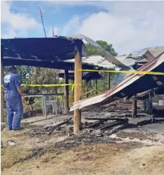  ?? Photo: Nicolette Chambers ?? A firefighte­r from the National Fire Authority inspecting the home on July 6, 2019.