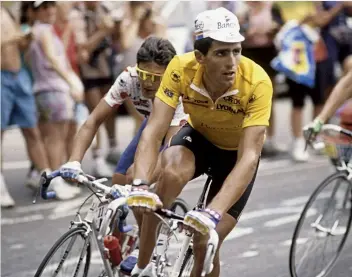  ??  ?? Indurain, en route to his irst Tour TT victory in Alençon during the 1991 raceIn yellow on Alpe’d’Huez, with Chiappucci in close attendance behind