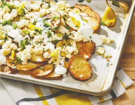  ?? TOM MCCORKLE/THE WASHINGTON POST ?? Greek-ish nachos made with potatoes are a delicious party snack, but will also work well as a dinner side.