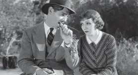  ?? PROVIDED BY COLUMBIA PICTURES ?? Clark Gable, munching his game-changing carrot, and Claudette Colbert in “It Happened One Night.”