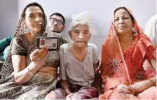  ?? ?? Manni, 101, has watched the last 10 decades of India’s journey unfold before her eyes; (right) 101-year-old Kela Devi with her family members at their residence in Haryan’s Nuh.