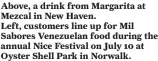  ?? ?? Above, a drink from Margarita at Mezcal in New Haven.
Left, customers line up for Mil Sabores Venezuelan food during the annual Nice Festival on July 10 at Oyster Shell Park in Norwalk.