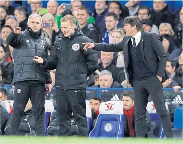  ??  ?? SIDELINE SKIRMISH: Manchester United manager Jose Mourinho, left, and Chelsea coach Antonio Conte, right, argue with the fourth referee during the FA Cup quarter-final last month.