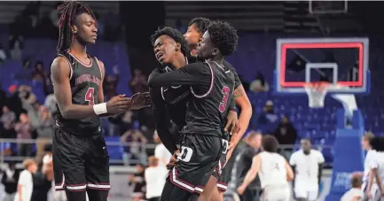  ?? GEORGE WALKER IV/THE TENNESSEAN ?? Frederick Douglass guard Taquez Butler (1) is helped off the court by teammates after losing 59-58 against Alcoa in the TSSAA Class 2A State Boys Basketball Tournament Championsh­ip game.