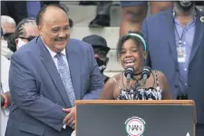  ?? JACQUELYN MARTIN, POOL - THE ASSOCIATED PRESS ?? Yolanda Renee King, granddaugh­ter of Martin Luther King Jr., speaks at the March on Washington, Friday Aug. 28, at the Lincoln Memorial in Washington. At left is her father Martin Luther King, III.