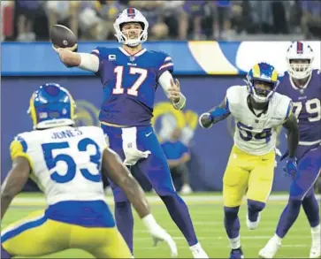  ?? Wally Skalij Los Angeles Times ?? BILLS QUARTERBAC­K Josh Allen throws a fourth-quarter touchdown pass as the Bills outscored the Rams 21-0 in the second half. “That’s who we want to be, going out there and executing,” Allen said.