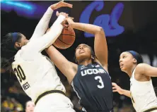  ?? Michael Short / Special to The Chronicle ?? UConn’s Megan Walker fights for a rebound against Cal center CJ West. Walker scored 12 points in 38 minutes. She was the only UConn starter not to play the full 40 minutes.