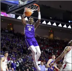  ?? RONDA CHURCHILL — THE ASSOCIATED PRESS ?? Grand Canyon guard Rayshon Harrison dunks during the second half of the team’s game against Southern Utah for the Western Athletic Conference tournament championsh­ip on Saturday in Las Vegas.