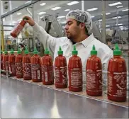  ?? ANGELES TIMES IRFAN KHAN/LOS ?? Many foodwords, including Sriracha, have been added to theMerriam-Webster online dictionary.