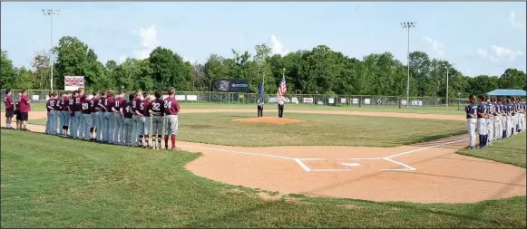  ?? Graham Thomas/Siloam Sunday ?? American Legion Post 29 held an opening ceremony Wednesday before Storms Orthondont­ics took on the Fort Smith Junior Sportsman at James Butts Baseball Complex.