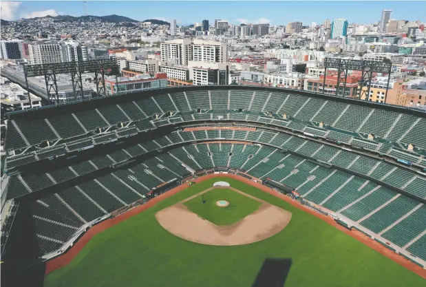  ?? Justin
Sulivan / Gett
y Imag
es ?? Oracle Park, home of the San Francisco Giants, sits empty on what was supposed to be opening day on Thursday.
National Post, Friday, March 2 7, 2020