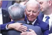  ?? MARIO TAMA/GETTY IMAGES ?? President Joe Biden hugs an audience member after delivering remarks at the Boys and Girls Club of West San Gabriel Valley on Tuesday in Monterey Park, California.