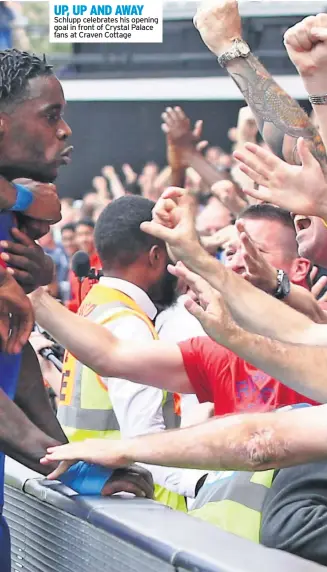  ??  ?? UP, UP AND AWAY Schlupp celebrates his opening goal in front of Crystal Palace fans at Craven Cottage