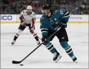  ?? NHAT V. MEYER — BAY AREA NEWS GROUP ?? San Jose Sharks’ Erik Karlsson controls the puck against the Washington Capitals during a game in 2019.