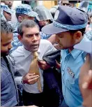  ??  ?? Former Maldivian president Mohamed Nasheed (c) has on July 24, had his 13-year prison sentence commuted to a term under house arrest, his internatio­nal lawyer Jared Genser said (AFP)