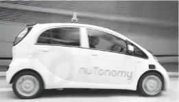  ??  ?? A self-driving vehicle using NuTonomy technology during a test drive in Singapore in 2016.