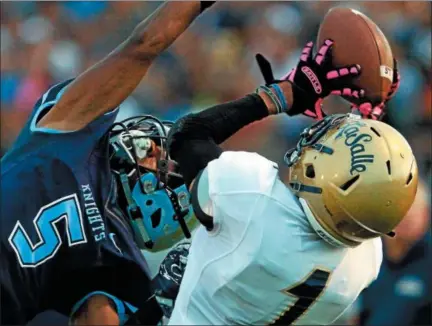  ?? BOB RAINES — DIGITAL FIRST MEDIA ?? North Penn’s Justis Henley tries to break up a pass to LaSalle’s Troy Holland in their game last season.