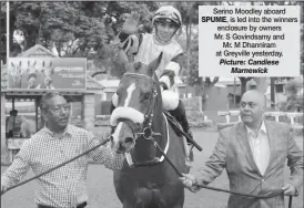  ?? Picture: Candiese Marnewick ?? Serino Moodley aboard SPUME, is led into the winners enclosure by owners Mr. S Govindsamy and Mr. M Dhanniram at Greyville yesterday.