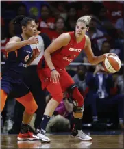  ?? PATRICK SEMANSKY - THE ASSOCIATED PRESS ?? Washington Mystics forward Elena Delle Donne, right, drives against Connecticu­t Sun forward Alyssa Thomas in the first half of Game 1 of basketball’s WNBA Finals, Sunday, Sept. 29, 2019, in Washington.