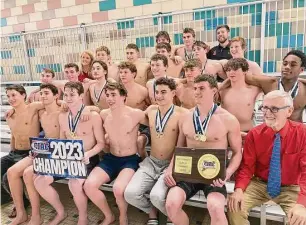  ?? Will Aldam/Hearst Connecticu­t Media ?? Members of the Greenwich boys swim team celebrate after winning the program’s ninth straight CIAC Class LL championsh­ip Thursday in West Hartford.