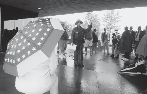  ?? Chris Kasprak/post-gazette ?? A group watches Saturday as park ranger Brendan Wilson provides a general introducti­on to the events, actions and people related to the story of Flight 93 and the Flight 93 National Memorial in Stonycreek, Somerset County.