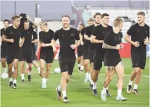  ?? — AFP ?? Denmark’s midfielder Christian Eriksen (C) and team-mate take part in a training session at the Al Sailiya SC Training Site in Doha.