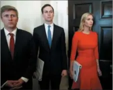  ?? EVAN VUCCI — THE ASSOCIATED PRESS ?? White House senior adviser Jared Kushner, center, and Ivanka Trump listen as President Donald Trump speaks during a cabinet meeting at the White House.