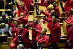  ??  ?? Members of the Economic Freedom Fighters party disrupt Parliament proceeding­s at the State of the Nation Address in Cape Town, South Africa.