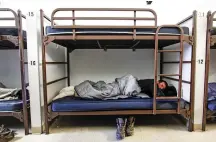  ?? GABRIELA CAMPOS/THE NEW MEXICAN ?? Joe, 35, rests in one of the bunk beds Friday at the Interfaith Community Shelter, recovering from the flu that he has been fighting for the last week.