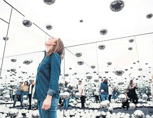  ?? VINCENT TULLO/THE NEW YORK TIMES FILE PHOTO ?? Yayoi Kusama’s Infinity Mirrored Room — Let’s Survive Forever. How much people enjoy art seems affected by contextual cues such as price or a creator’s reputation.