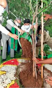  ??  ?? Chief Justice of India N.V. Ramana plants a sapling at the Raj Bhavan in Hyderabad on Tuesday.