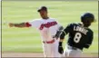  ?? TONY DEJAK — THE ASSOCIATED PRESS ?? Jose Ramirez, left, forces the Athletics’ Jed Lowrie out at second base and relays to get Matt Olson out at first base in the sixth inning on July 7.