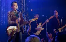  ?? Colleen Hayes/Netflix ?? Ed Helms performs with Weezer in “Family Switch.”