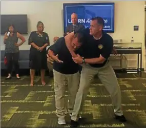  ?? KATHLEEN CAREY — DIGITAL FIRST MEDIA ?? A headlock maneuver is demonstrat­ed for teachers during last week’s seminar on school safety by the county District Attorney’s Office.